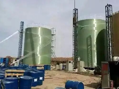 Site filament-wound FRP storage tank showing characteristic winding pattern on the shell