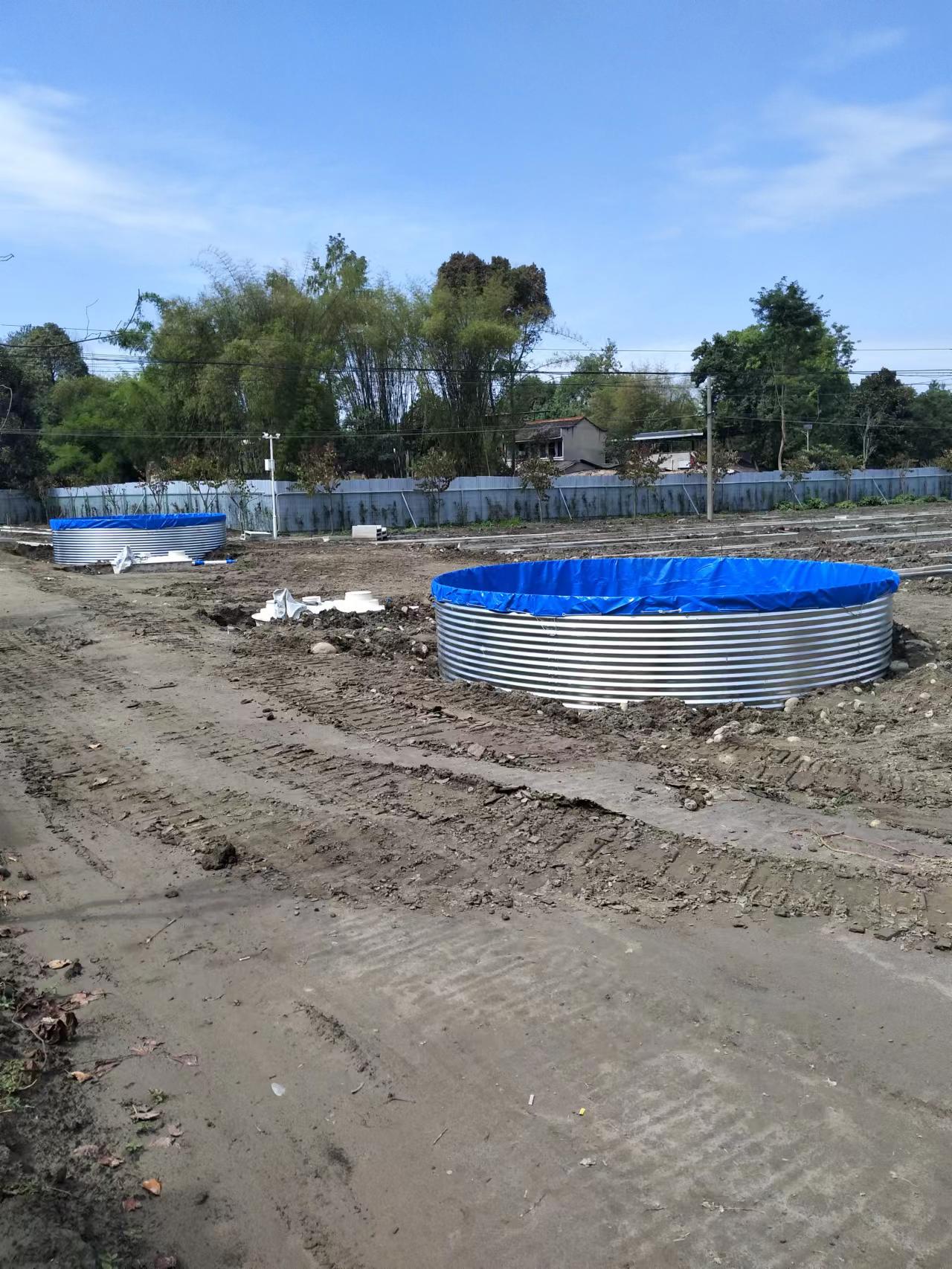 Two galvanized canvas fish ponds side by side, ready for a RAS farm